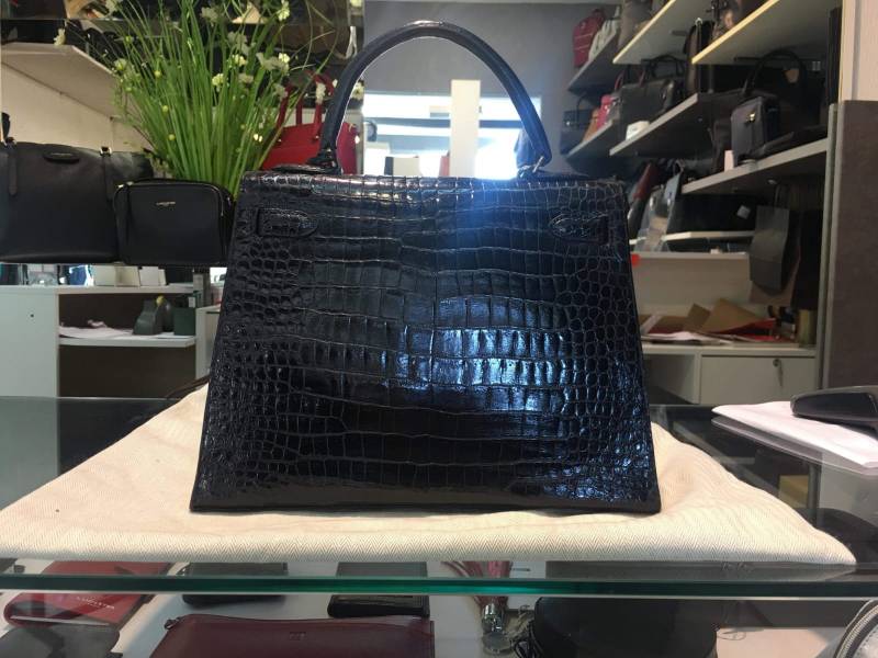 Restauration complète d'un sac Hermès modèle Kelly en crocodile à Cannes